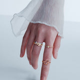 Qeelin Wulu mini solitaire ring in 18K rose gold set with diamonds