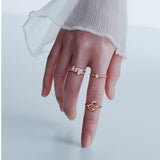 Qeelin Wulu mini solitaire ring in 18K yellow gold set with diamonds